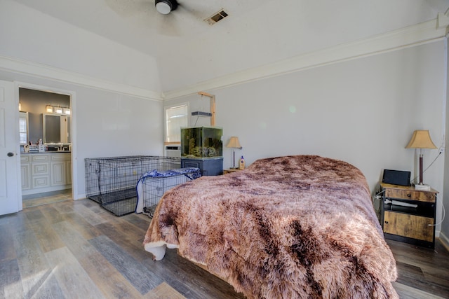 bedroom with ensuite bathroom, lofted ceiling, crown molding, ceiling fan, and hardwood / wood-style floors