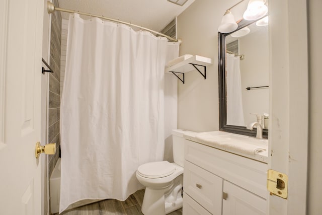 bathroom with vanity, hardwood / wood-style floors, and toilet