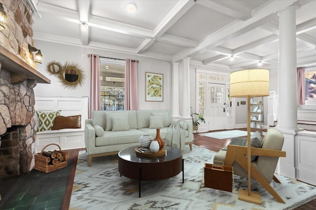 sitting room featuring coffered ceiling, decorative columns, beam ceiling, a fireplace, and hardwood / wood-style floors