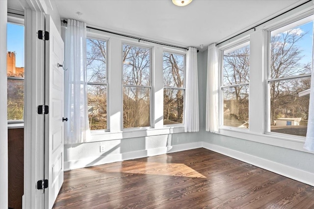 unfurnished sunroom featuring a wealth of natural light