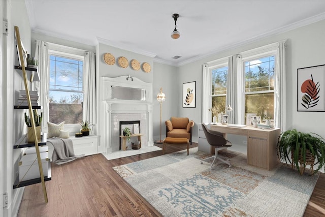 living area featuring crown molding, a brick fireplace, and dark hardwood / wood-style floors