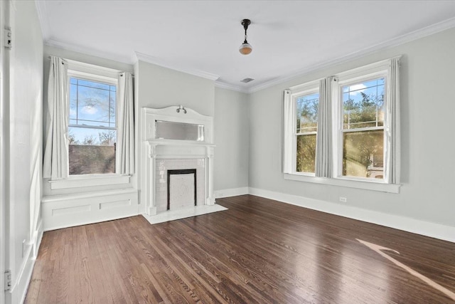 unfurnished living room with ornamental molding, wood-type flooring, and a fireplace