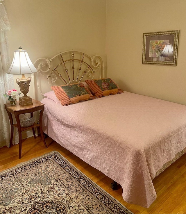 bedroom featuring wood-type flooring