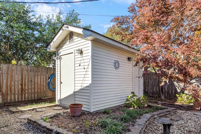 view of shed with a fenced backyard