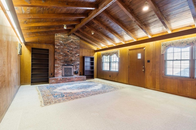 unfurnished living room featuring carpet, wooden ceiling, vaulted ceiling with beams, and wooden walls