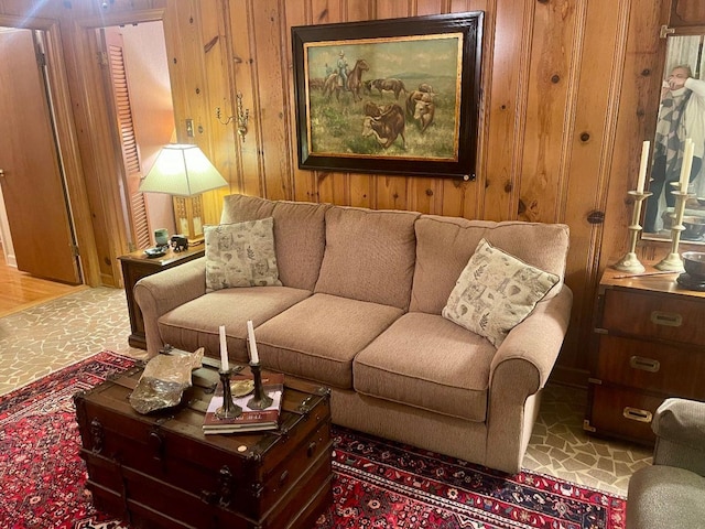 living area featuring wooden walls