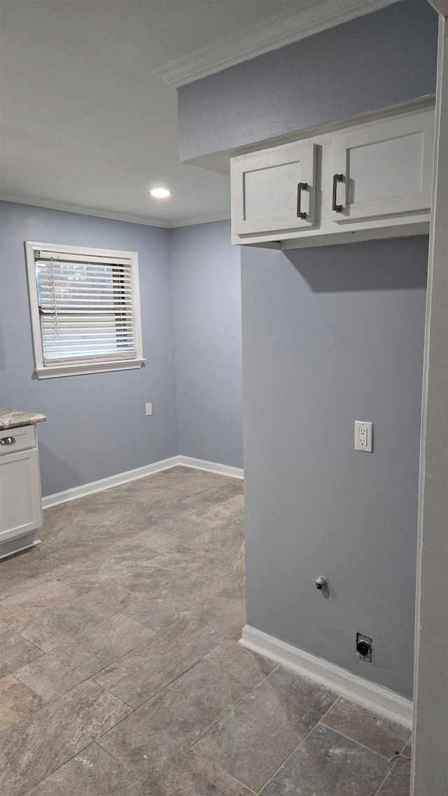 clothes washing area featuring ornamental molding