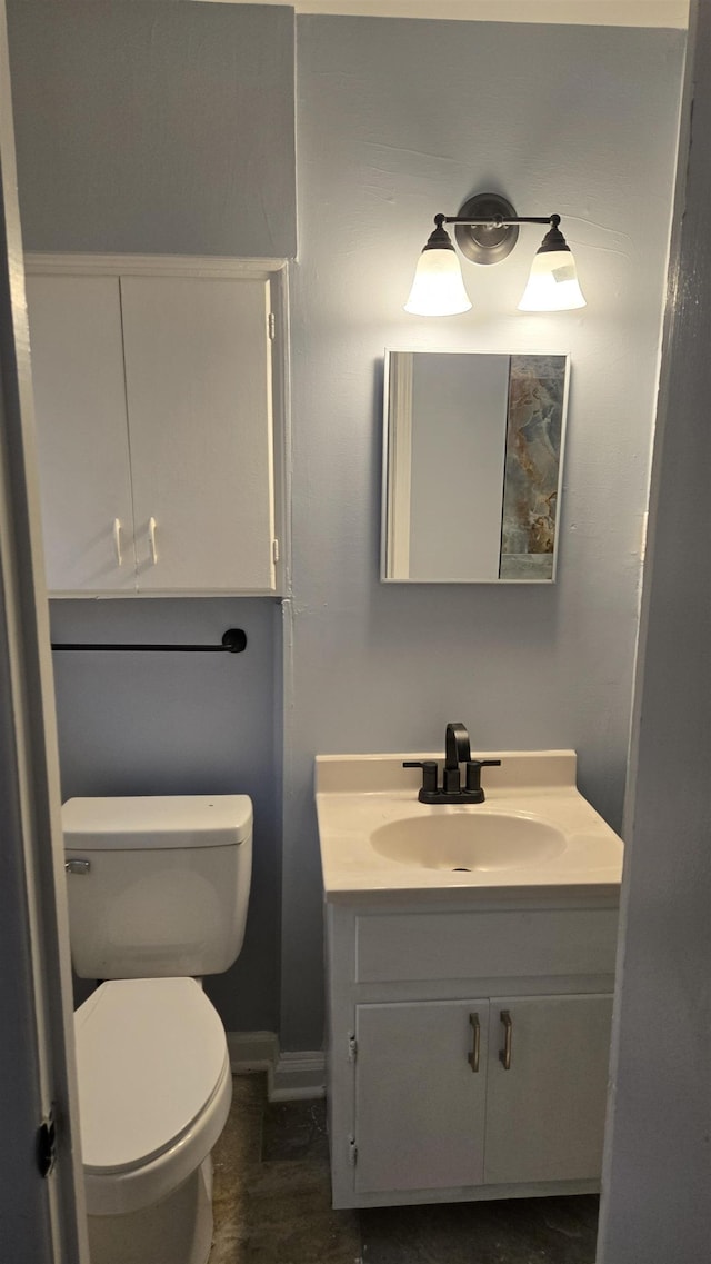 bathroom with vanity and toilet