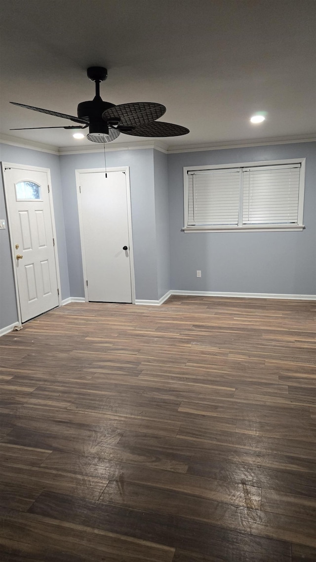 foyer featuring crown molding, ceiling fan, and dark hardwood / wood-style flooring