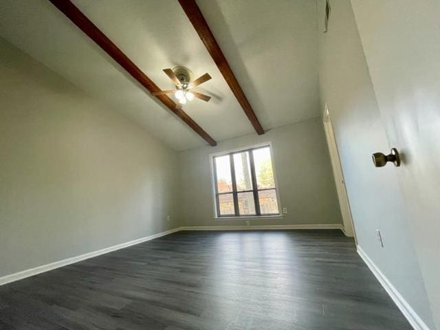 unfurnished room featuring dark wood-type flooring, ceiling fan, and lofted ceiling with beams