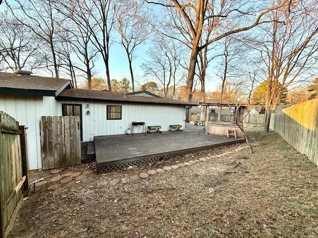 back of house featuring a deck