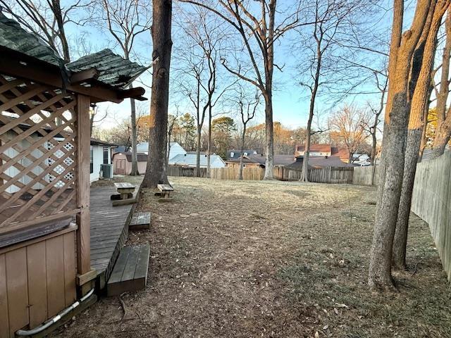 view of yard featuring a wooden deck