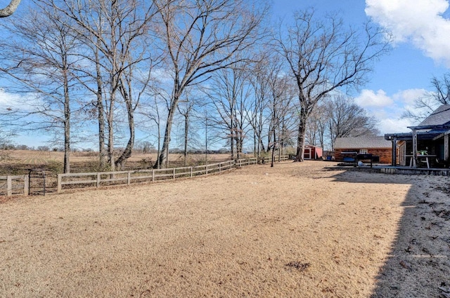 view of yard with a rural view