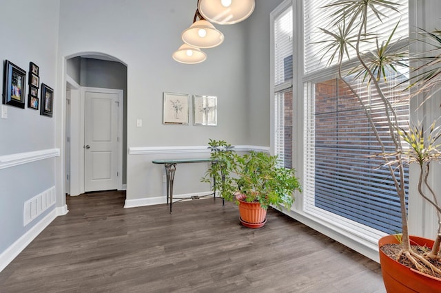 interior space with dark hardwood / wood-style floors