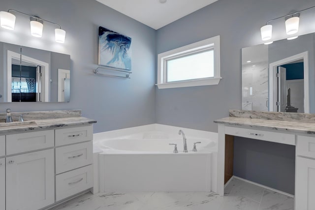 bathroom featuring vanity and shower with separate bathtub