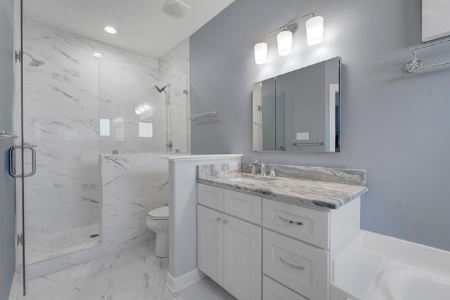 bathroom featuring vanity, toilet, and walk in shower