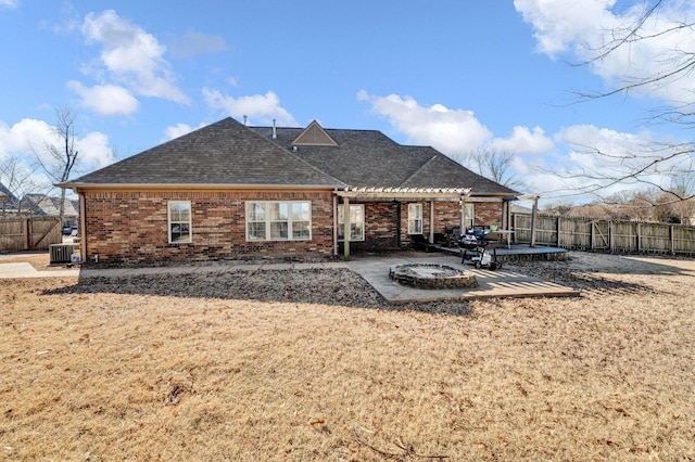 rear view of house featuring cooling unit, a yard, and a patio area