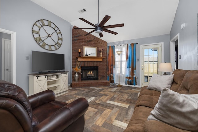 living room featuring ceiling fan, lofted ceiling, a fireplace, and dark parquet floors