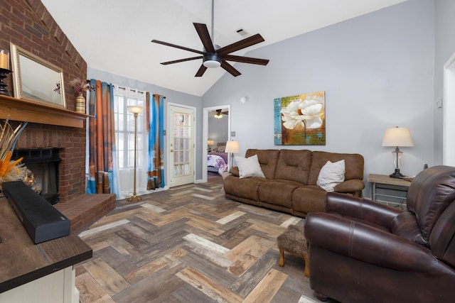 living room featuring dark parquet flooring, a fireplace, ceiling fan, and vaulted ceiling