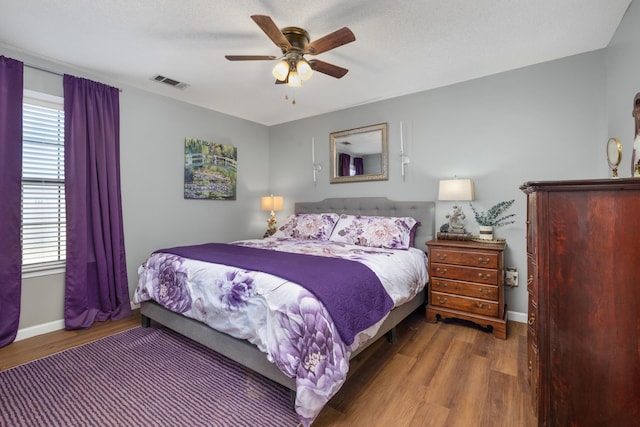 bedroom featuring dark wood-type flooring and ceiling fan