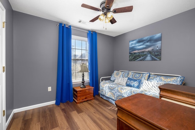 bedroom featuring ceiling fan and wood-type flooring