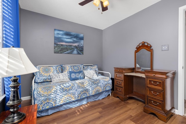 bedroom with wood-type flooring and ceiling fan