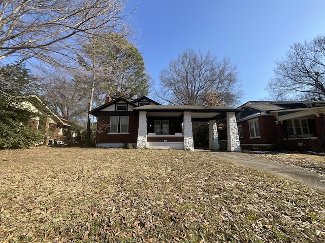 view of front of property featuring a carport