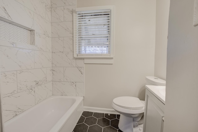 bathroom featuring vanity, tile patterned floors, and toilet