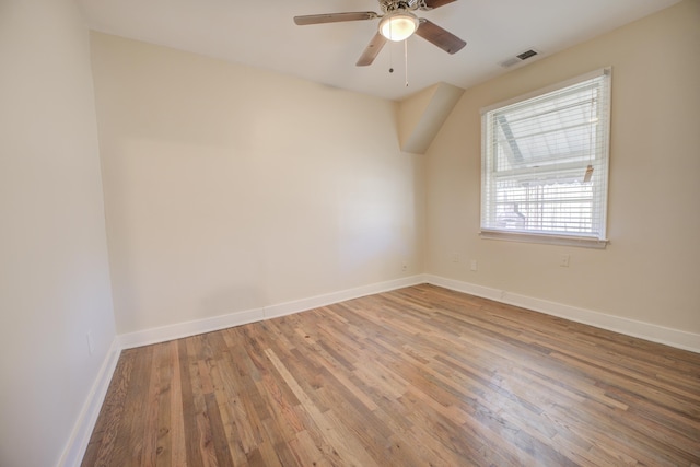 unfurnished room with hardwood / wood-style flooring and ceiling fan