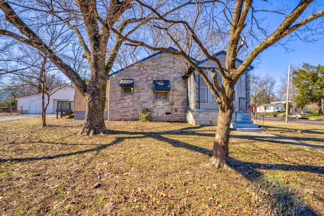 view of side of property with a lawn