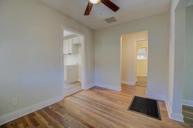 unfurnished room with wood-type flooring and ceiling fan