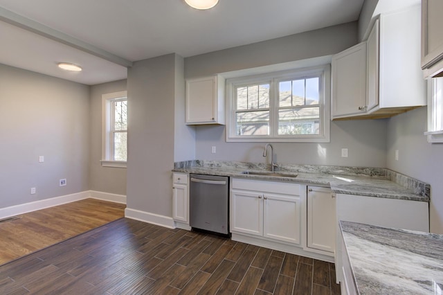 kitchen featuring white cabinetry, sink, light stone counters, and dishwasher