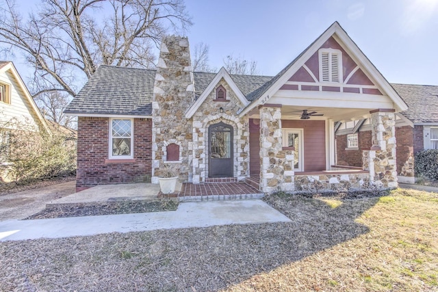 tudor-style house with covered porch