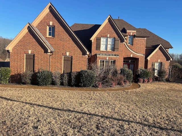 view of front of house featuring brick siding