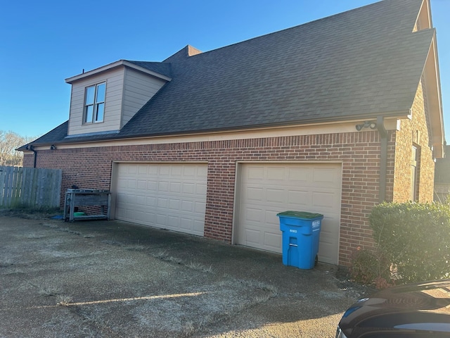 garage with aphalt driveway