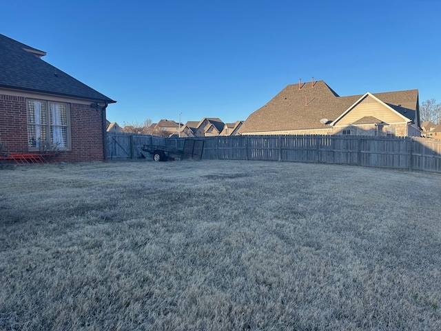 view of yard featuring a fenced backyard