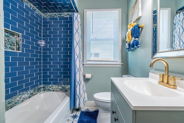 full bathroom featuring shower / tub combo with curtain, vanity, and toilet