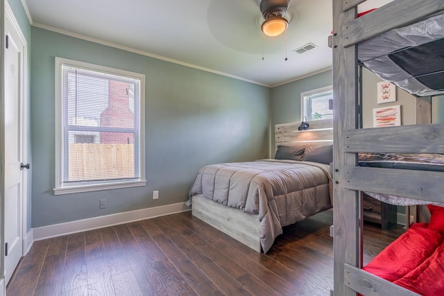 bedroom featuring dark wood-type flooring, ceiling fan, and crown molding