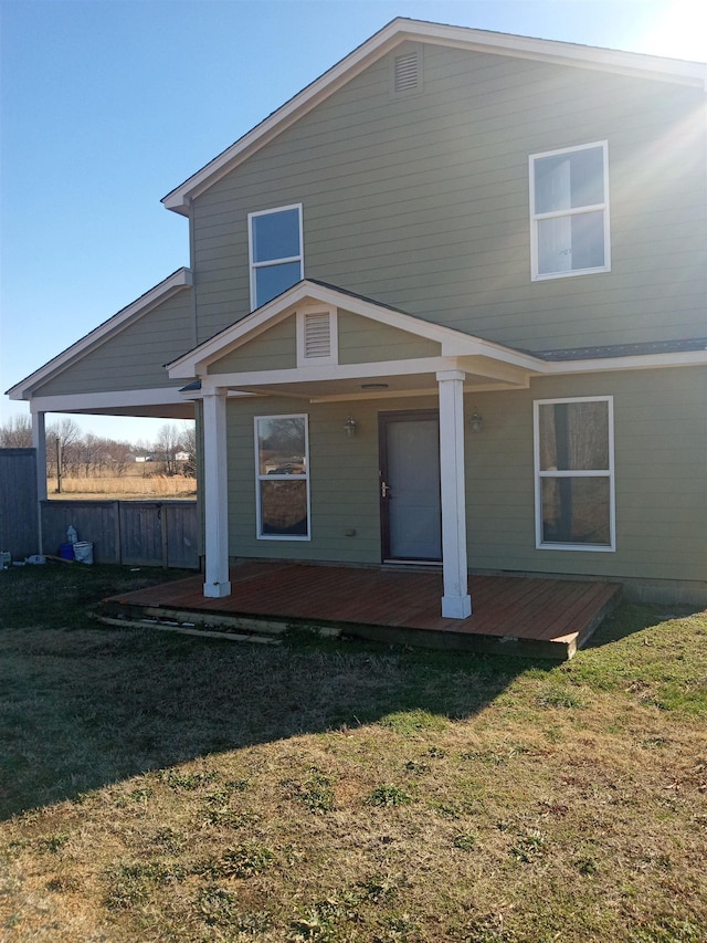 back of house featuring a yard