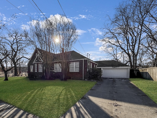 view of front of property with a garage and a front yard