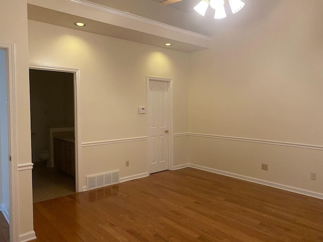 empty room with dark hardwood / wood-style floors and ceiling fan