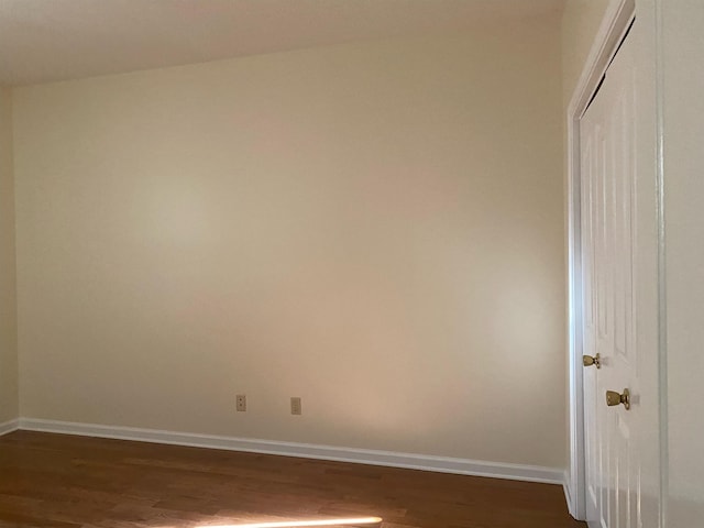 empty room with hardwood / wood-style flooring