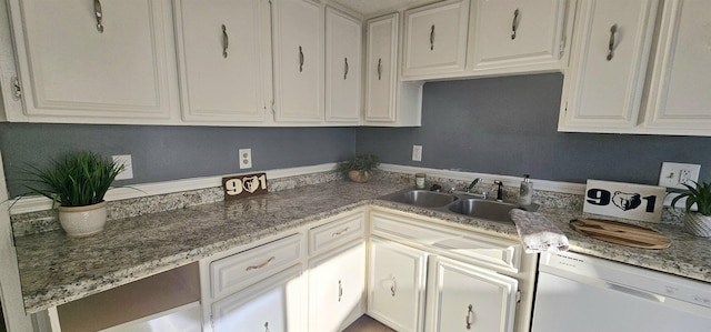 kitchen with dishwashing machine, sink, light stone countertops, and white cabinets