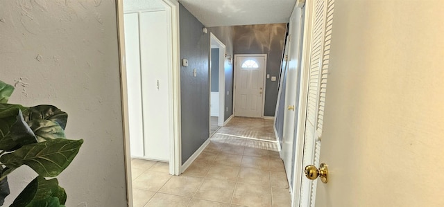 hall with light tile patterned flooring