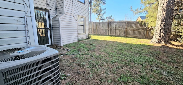 view of yard featuring central air condition unit