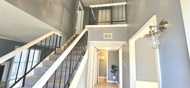 stairway with crown molding