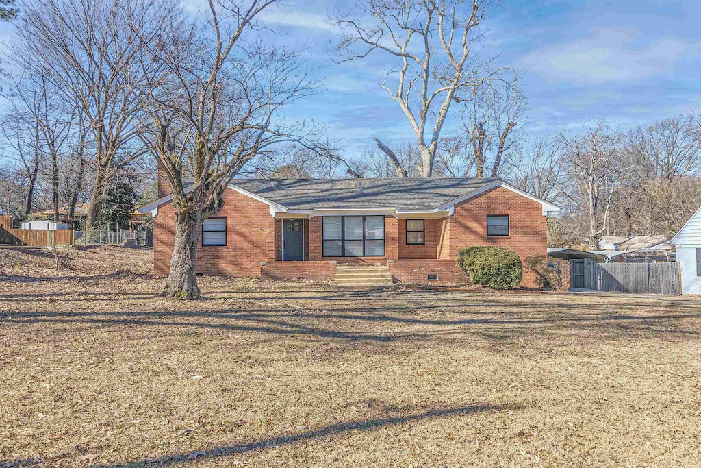 ranch-style house with a front yard