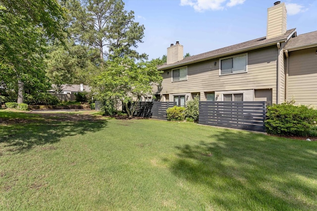 1819 Crossflower Cv Unit 85, Germantown, TN 38138 - back of house featuring a chimney