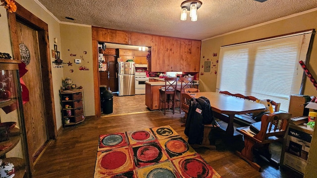 dining room featuring crown molding, a textured ceiling, and dark hardwood / wood-style flooring