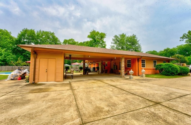 exterior space featuring a carport